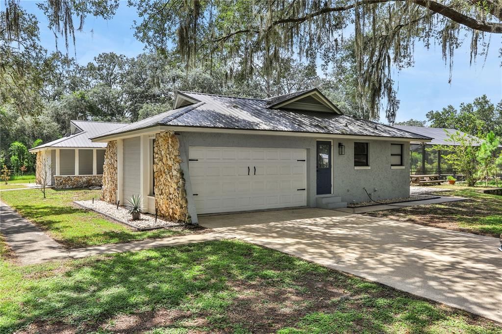 Driveway leads up to Side Entrance of the house