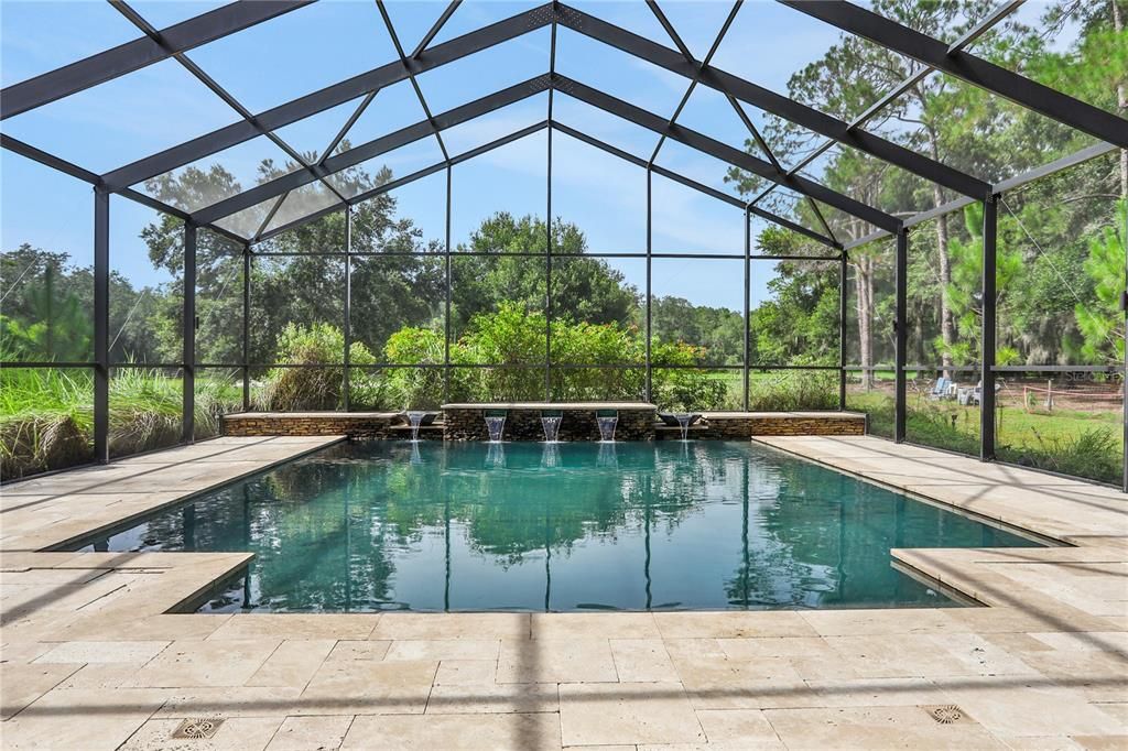 Custom Built Pool (22' X 25') with beautiful waterfall features with a 180 view of pool and back section of this massive property.