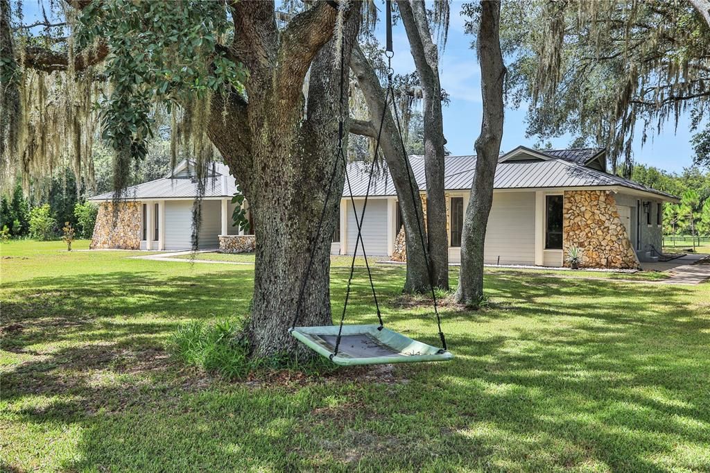 Beautiful Oaks surround the home and provide ample shade