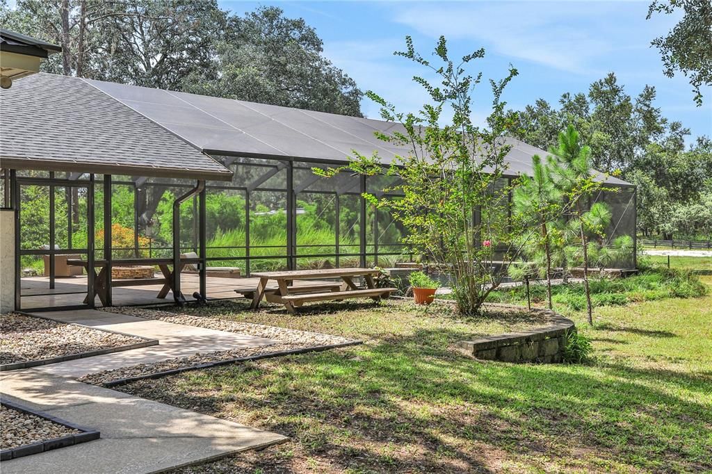 A short walk to the custom built pool and outdoor kitchen