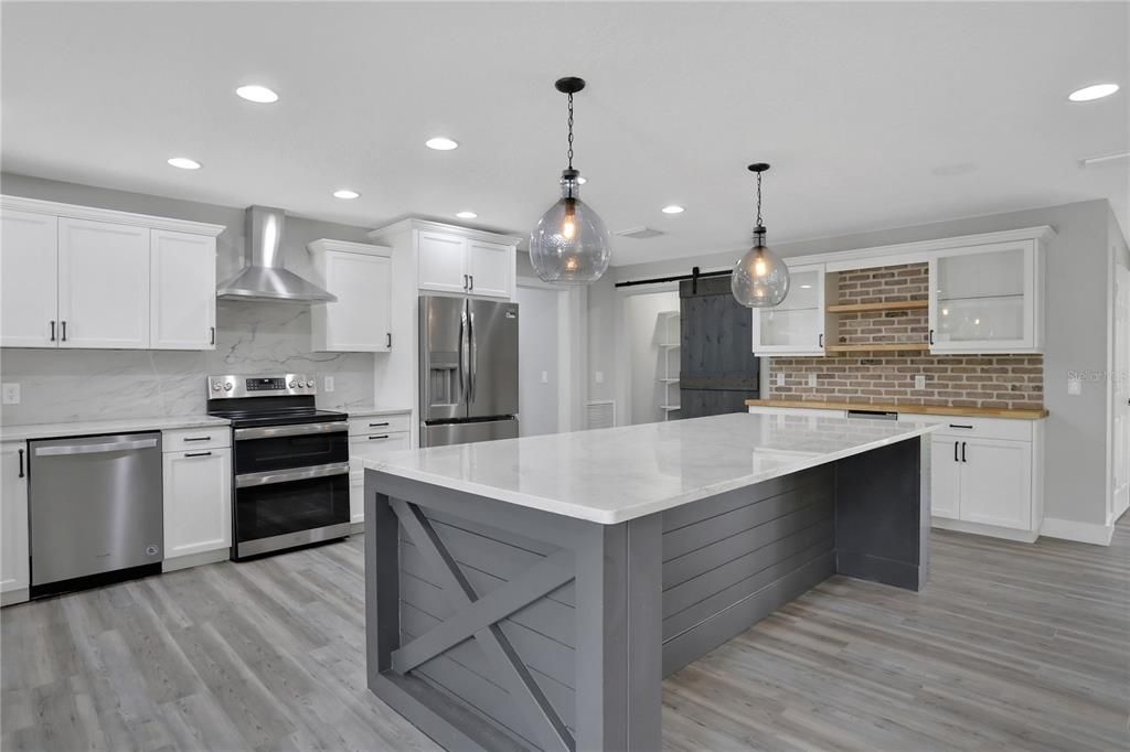 Stainless Steel Appliances and Quartzite Countertops/backsplash