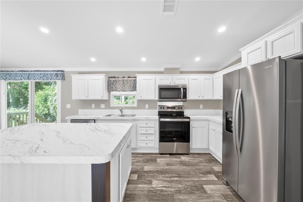 Kitchen w/view of Sliding Glass Door to Back Yard