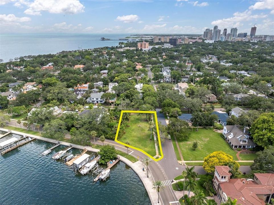 Land lot only, water lot is not included.  Street facing the water is Coffee Pot Blvd. Downtown St Petersburg in the view, walkable !