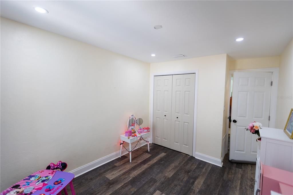 DOWN STAIRS BEDROOM FACING LIVING ROOM