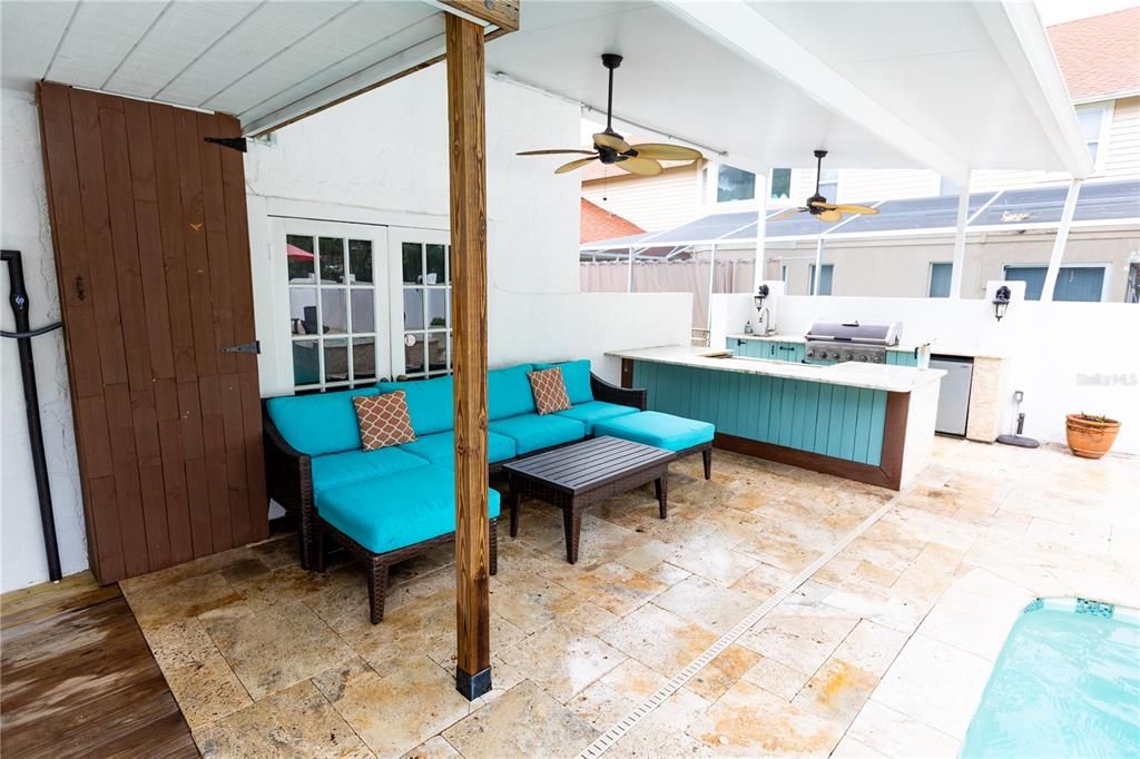 COVERED POOL PATIO FACING OUTDOOR GRILL