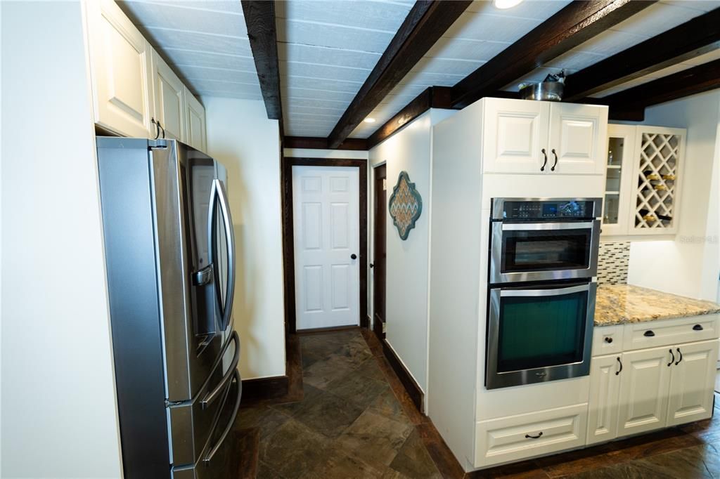 KITCHEN FACING STUDIO OFFICE AND HALF BATH 2