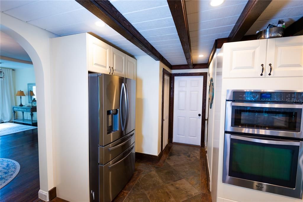 KITCHEN FACING STUDIO OFFICE AND HALF BATH ON RIGHT