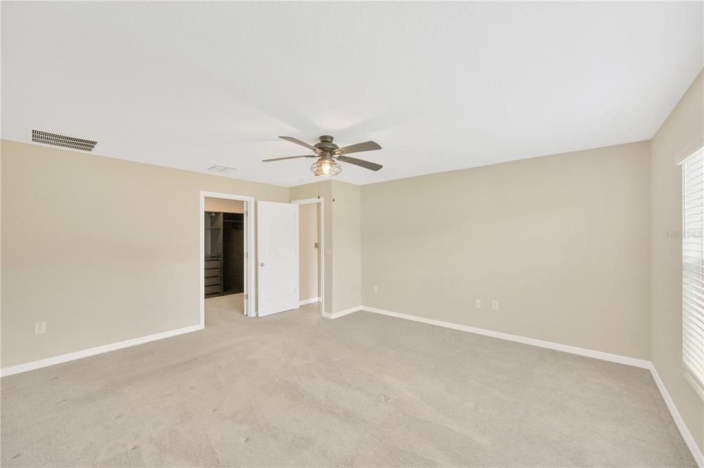 The split floor plan ensures privacy, with the owner's suite located at the rear of the home separate from the hallway to the secondary bedrooms and laundry.