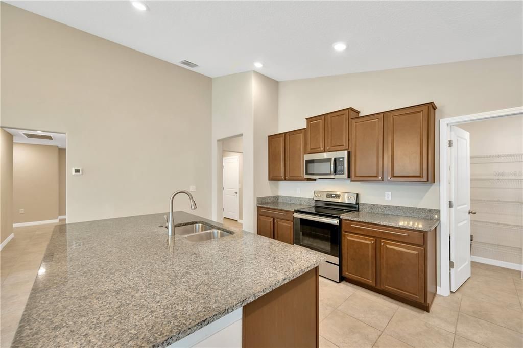 Large kitchen island gives lots of room for meal prep and additional seating for family & guests.