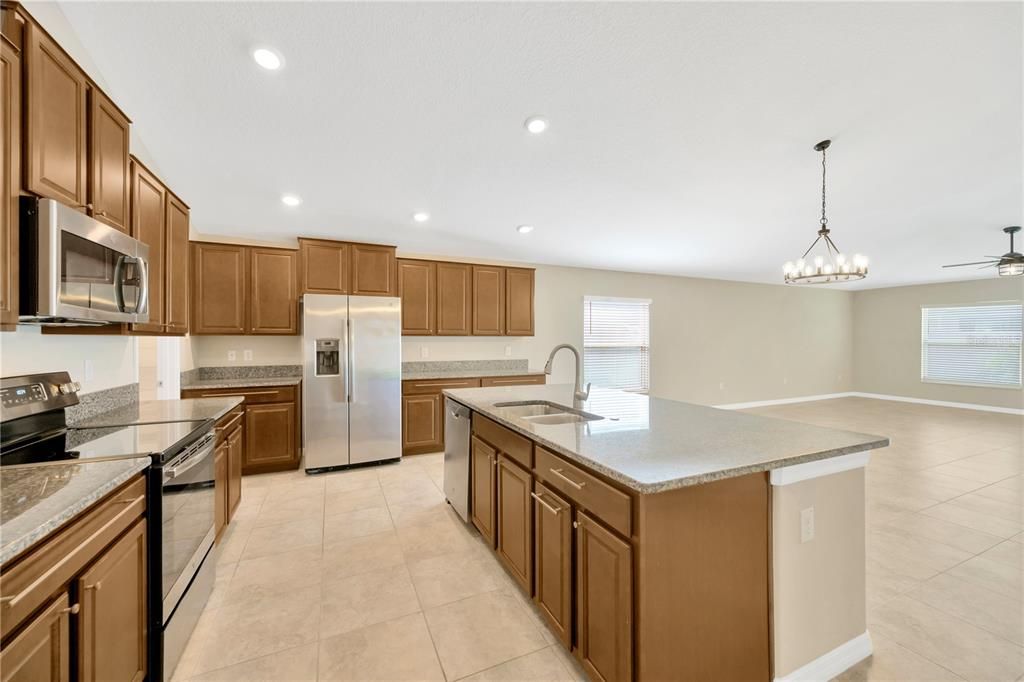 Wide space around the huge island makes room for multiple chefs in the kitchen.