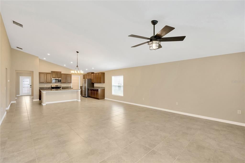 View of the kitchen and dining area from the sliding doors at the back of the home.