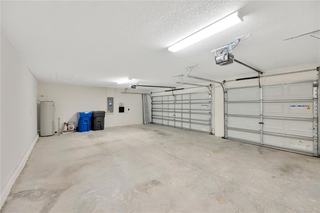 The 3 car garage is large for all your toys!  Overhead garage door openers, irrigation system timer, water heater and hurricane shutter storage in garage.