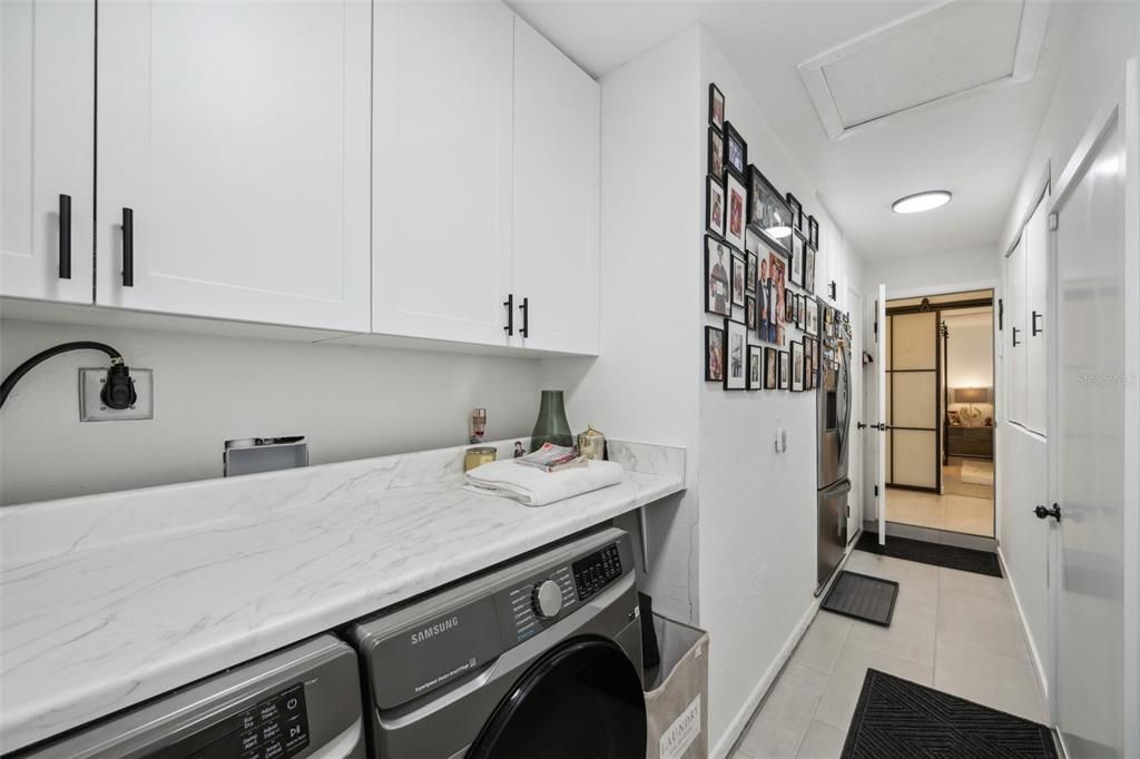 Laundry room features built in cabinets