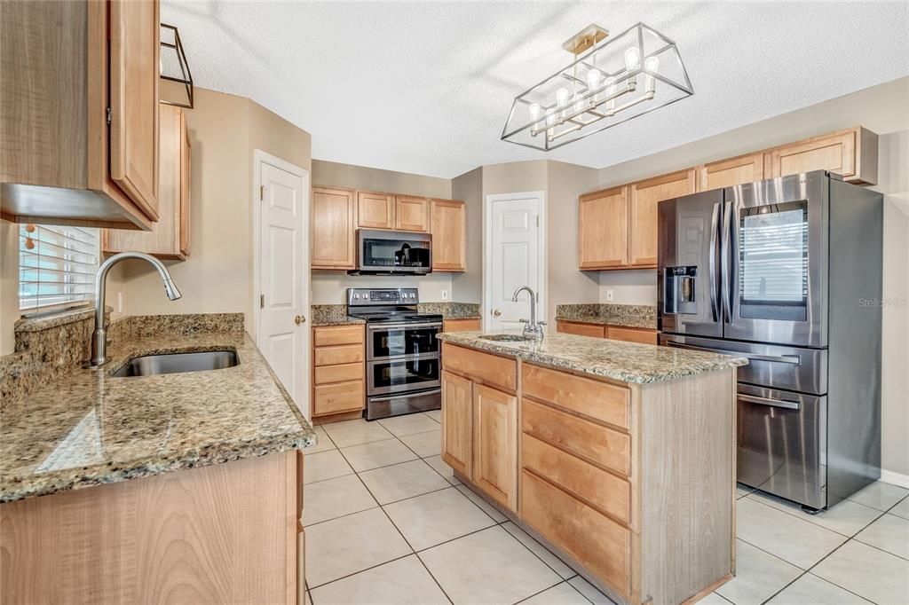 granite countertops, an abundance of cabinetry