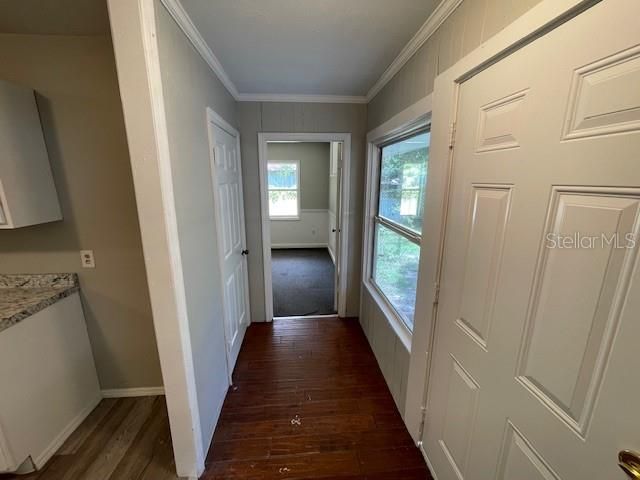 Entry door (right) looking toward bedroom