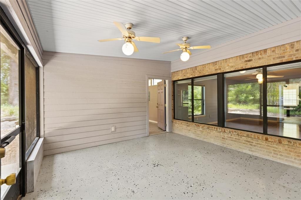 Covered screened in porch showing studio door