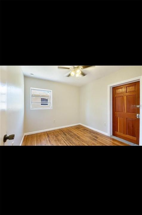 Bedroom 2 & Door to the garage