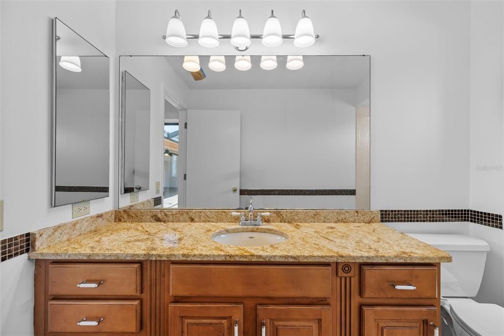 Full bath with a shower/tub combo that the 2 guest bedrooms share