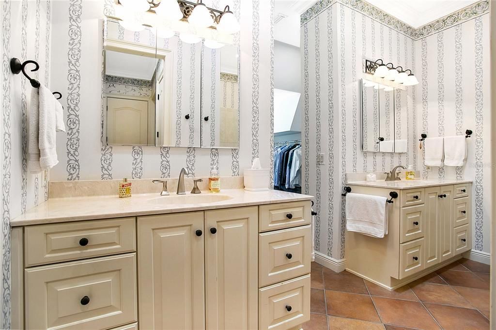 Primary Bathroom with double vanities, features private water closet