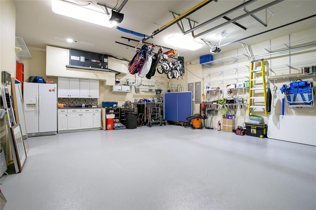 Oversized 2 car garage with motorized hanging storage