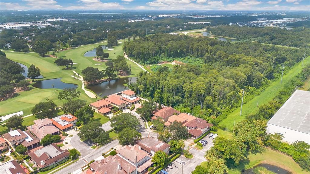 View of Country Club Villas neighborhood and Country Club of Orlando golf course.  There is designated space for extra parking and boat parking.