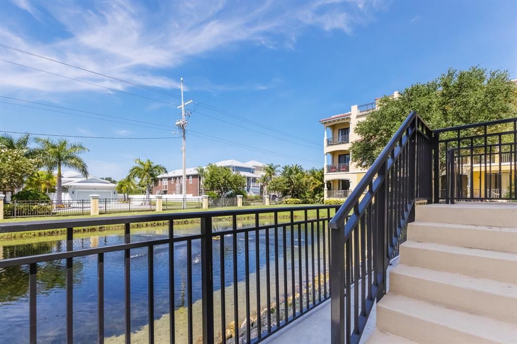 First floor private balcony overlooking pond and waterfall