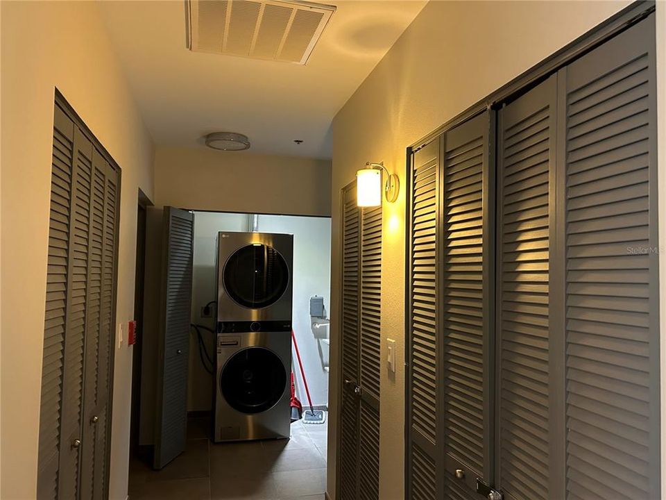 hallway with washer and dryer