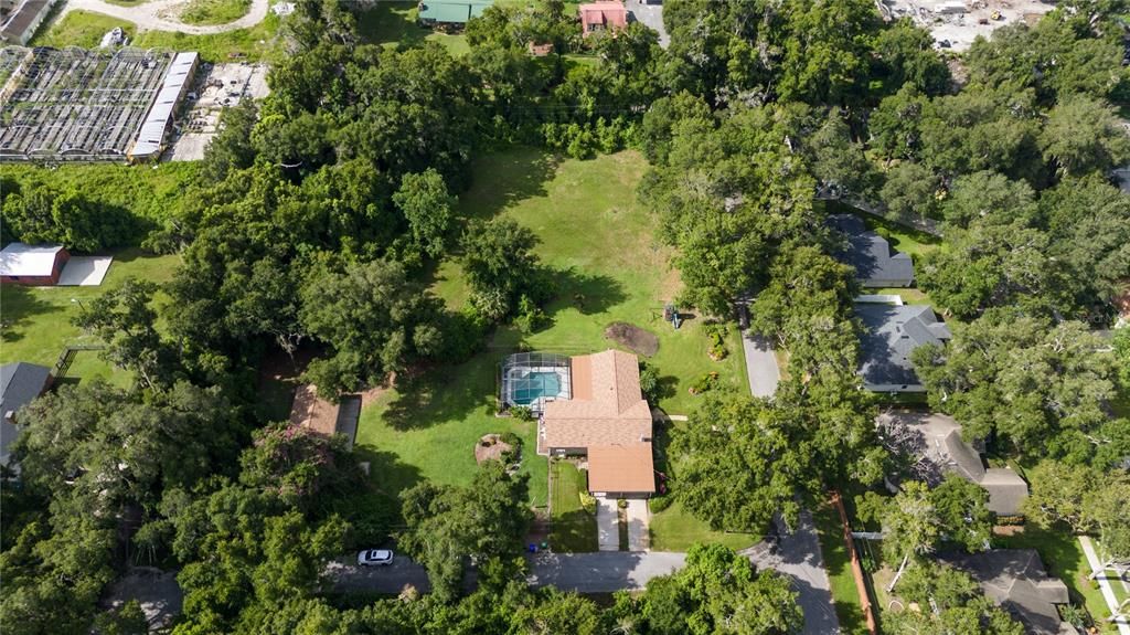 Enjoy .61 acres, tucked away but close to everything. Adjacent 1.2 acre property available separately