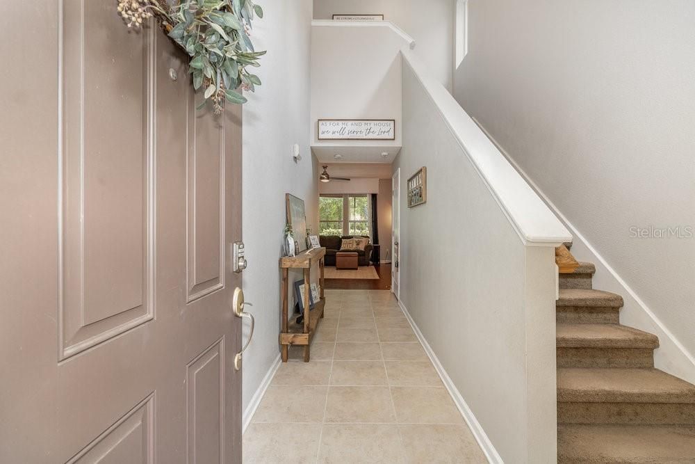 Foyer entry with soaring ceilings.