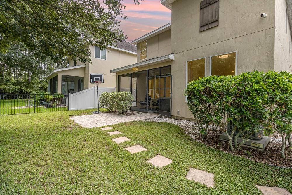 Large fenced yard on conservation lot.