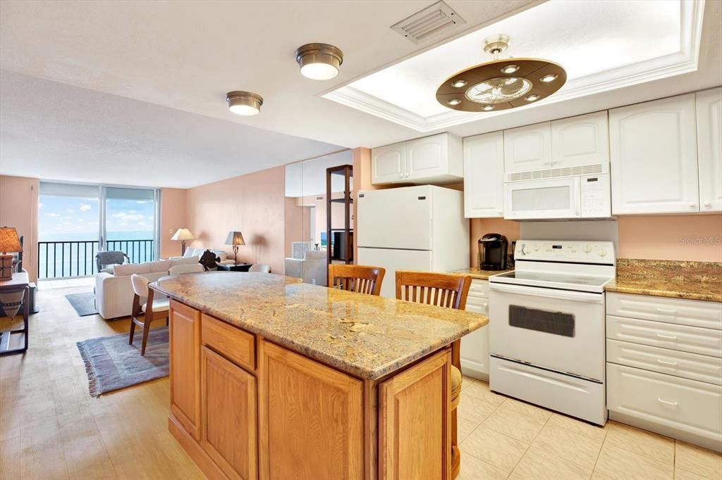 Open concept kitchen, dining and living room flow.