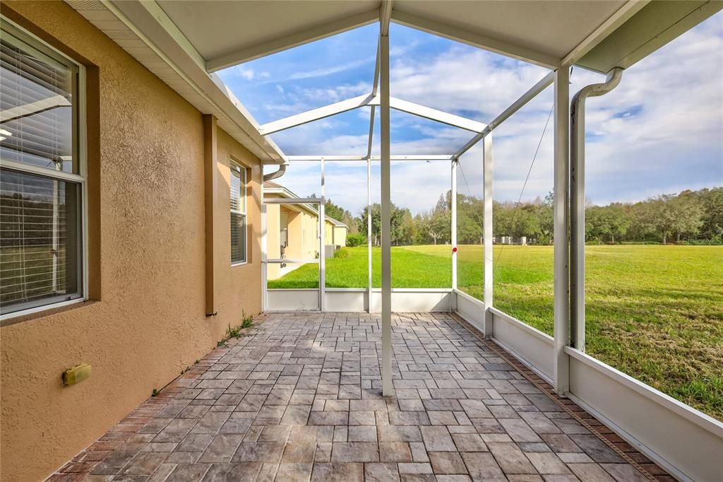 Spacious screened-in back patio