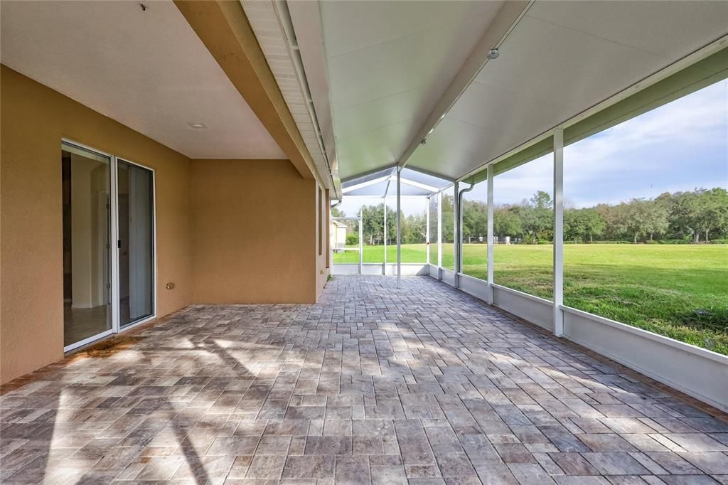 Spacious screened-in back patio