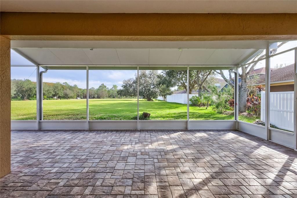 Spacious screened-in back patio