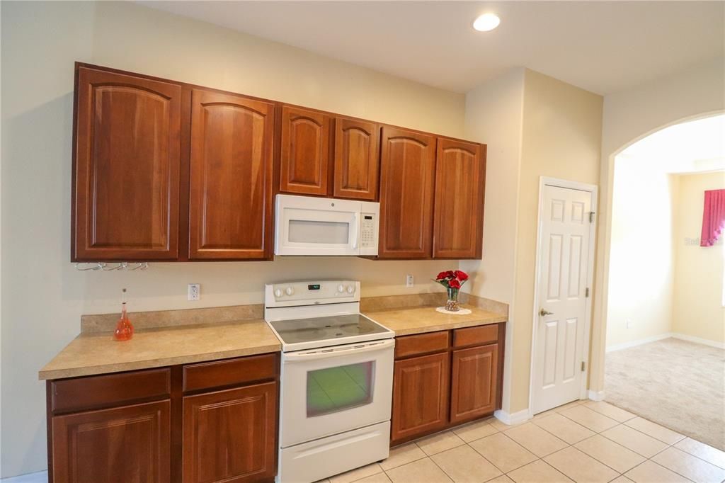 The Kitchen appliances with wood cabinets..