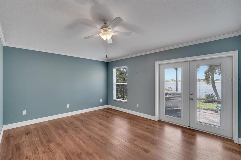 Primary Suite with Double Doors leading to the Lanai and that gorgeous view!