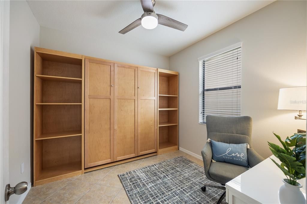 Bedroon 2 Flex Space with built in custom Queen size bed with lots of shelving and space for an in home office, New ceiling fan and window treatment