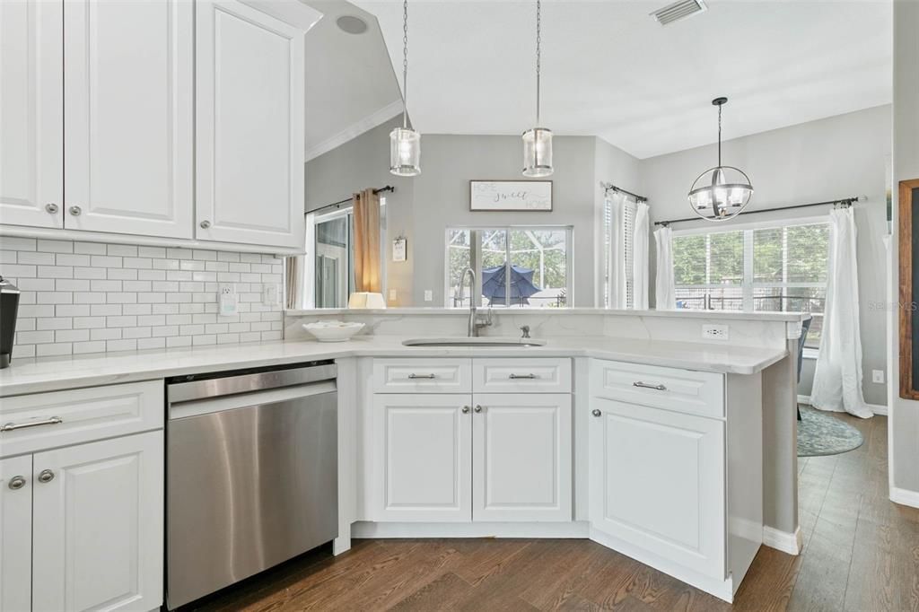 Stunning updated Open kitchen with custom cabinetry, quartz countertops and stainless steel appliances.