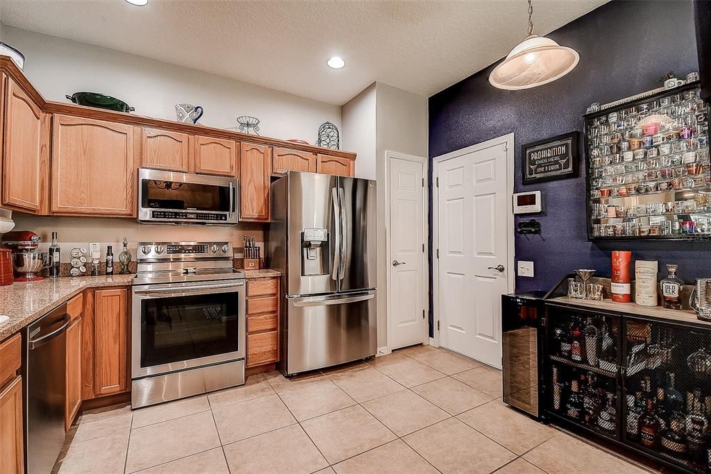 Kitchen granite counter tops & stainless appliances.