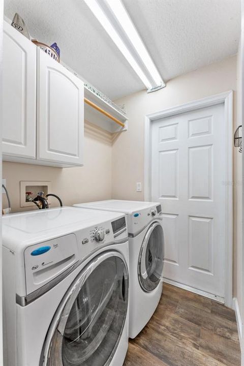 Interior laundry room with storage