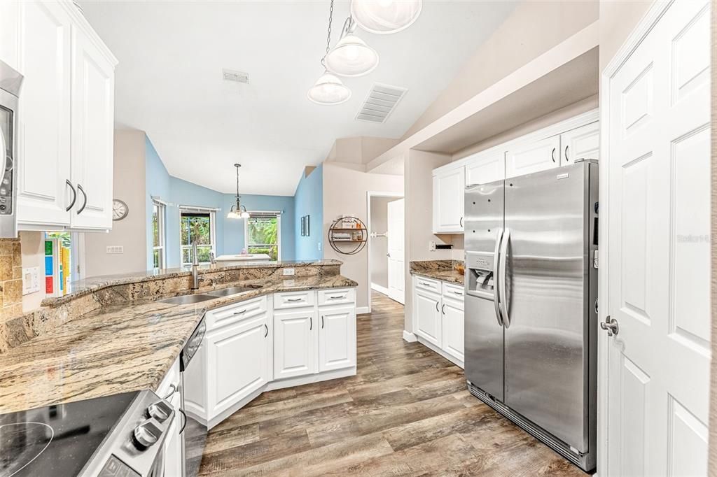 Double sink, stainless steel appliances.