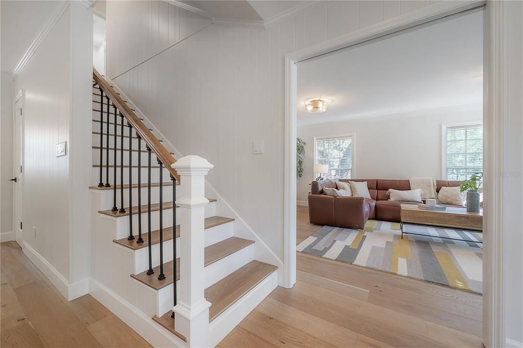 Stairs to second story located in kitchen/dining area