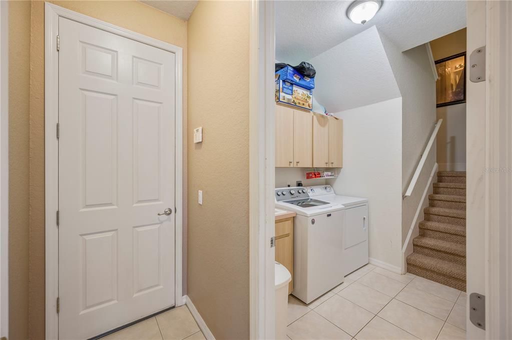 Laundry room and stairs to bonus room