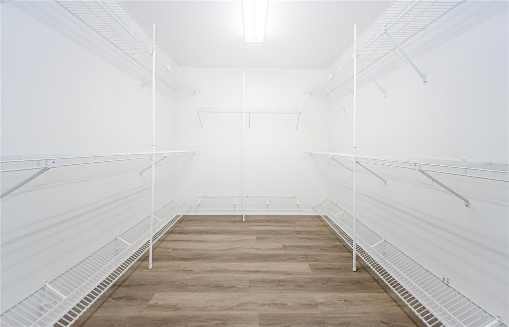 Huge walk-in closet freshly painted, new shelving and flooring!