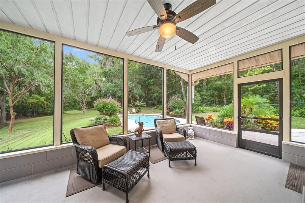 SCREEN PORCH WITH VIEW OF POOL