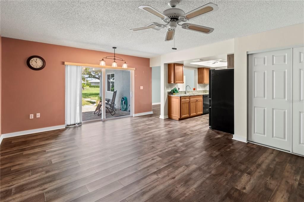 Family room looking into kitchen and outside