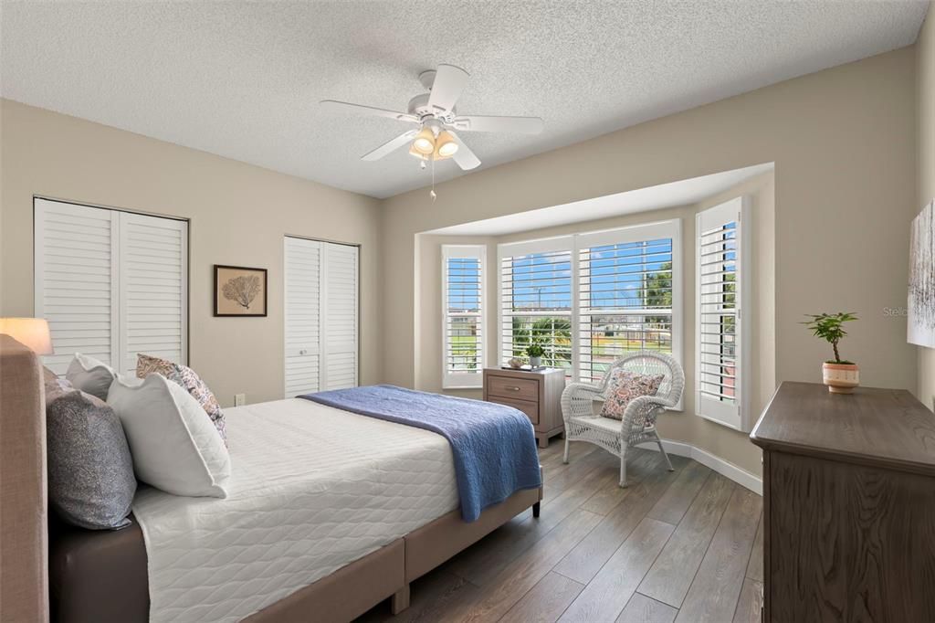 Main Level Guest Bedroom with Bay Window and Peek-a-boo water view