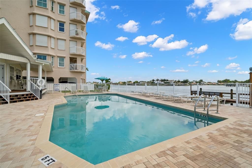 First Floor Patio with Path to the Pools and Docks