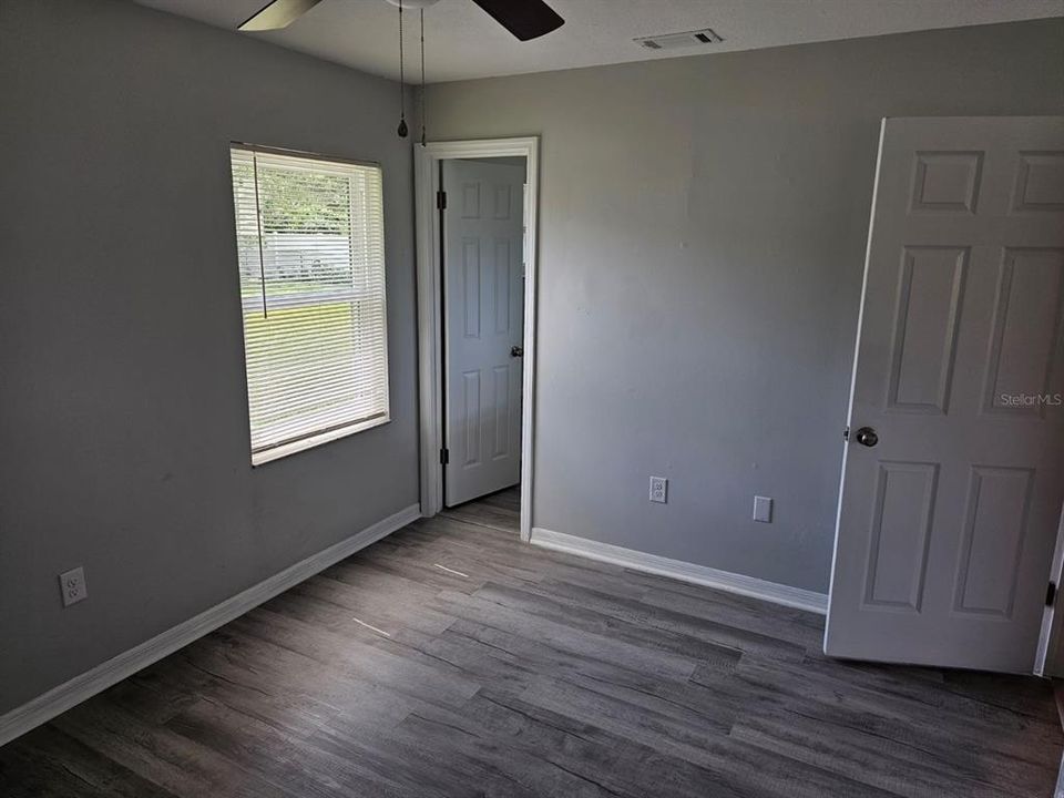 Primary back bedroom bathroom and closet wall