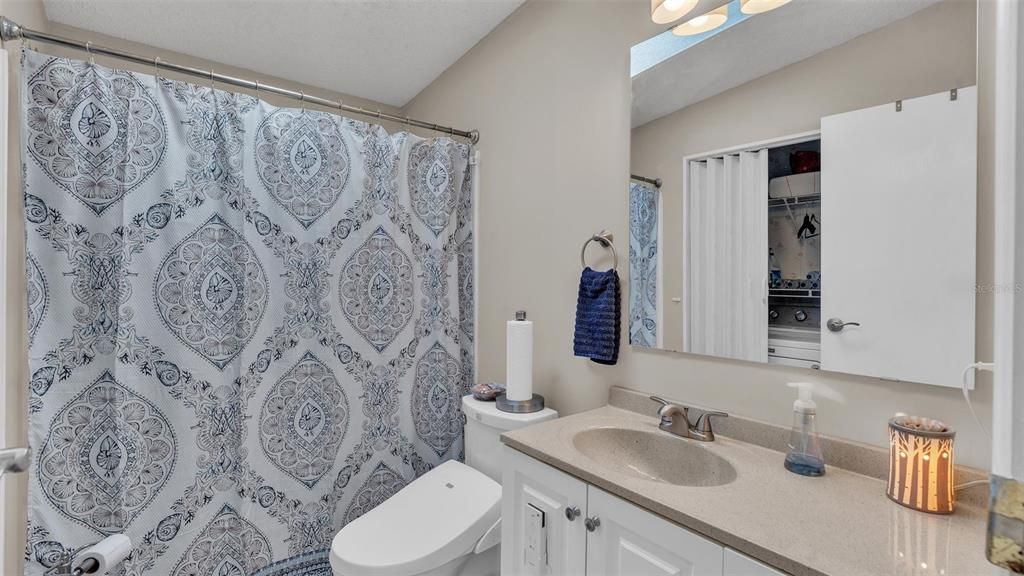 guest bathroom, laundry located inside closet